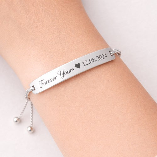 personalised silver bracelet on a ladies wrist for anniversary